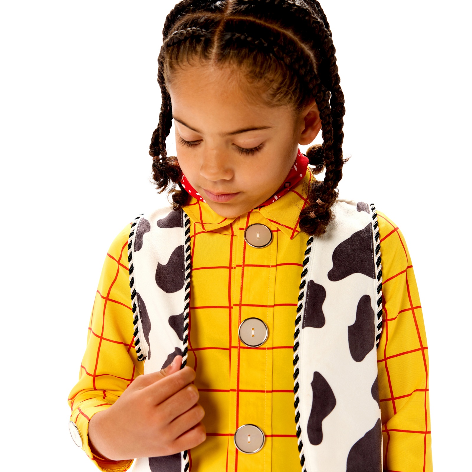 Child showing the Woody costume shirt and cow-print vest