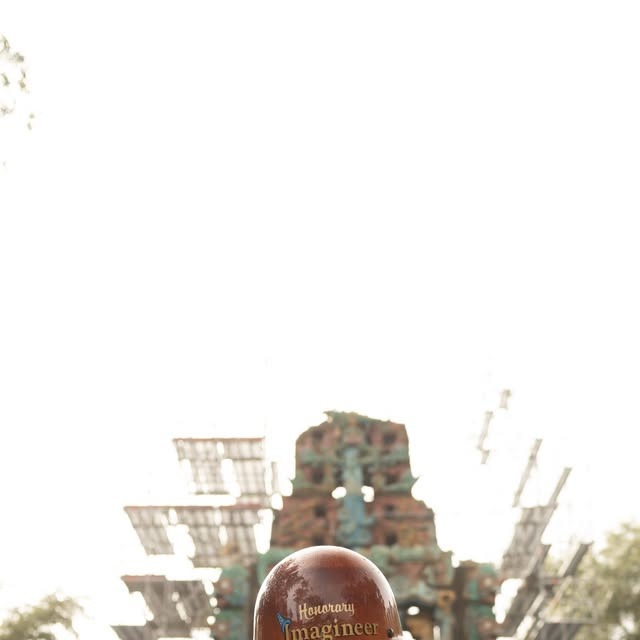 A blue-green carved temple facade rises behind scaffolding in Disney’s Tropical Americas construction area