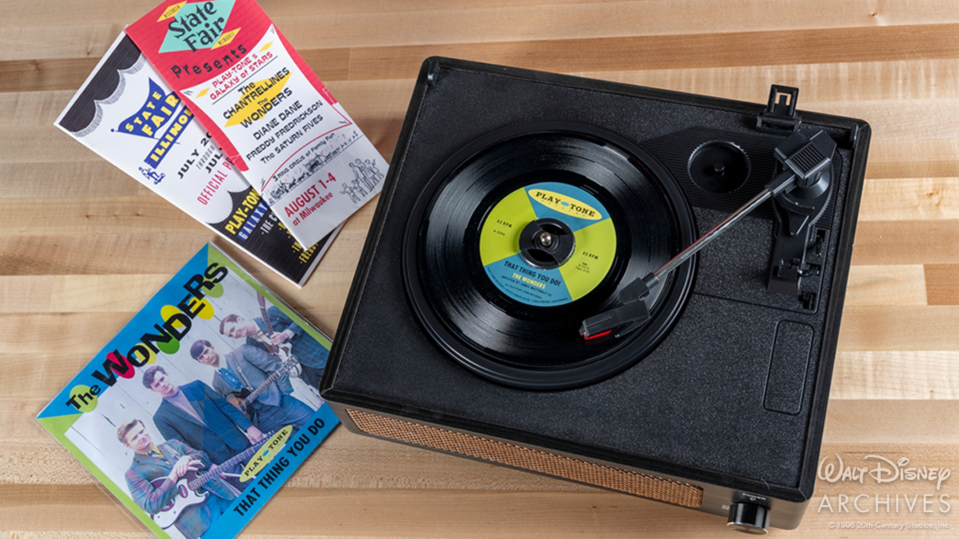 A record player, That Thing You Do prop record and Play-Tone tour brochures