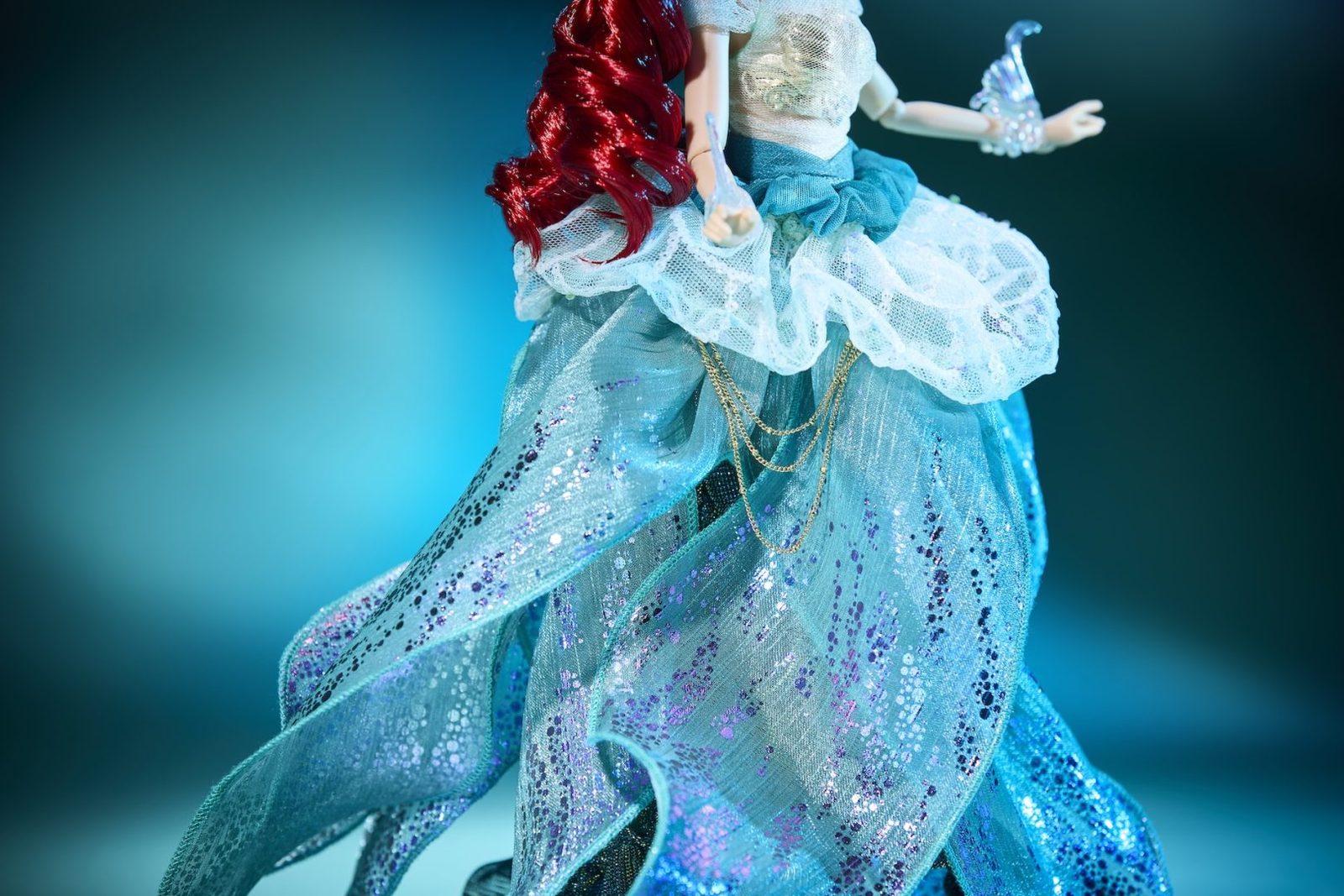 Close view of Ariel Designer Doll’s layered blue dress