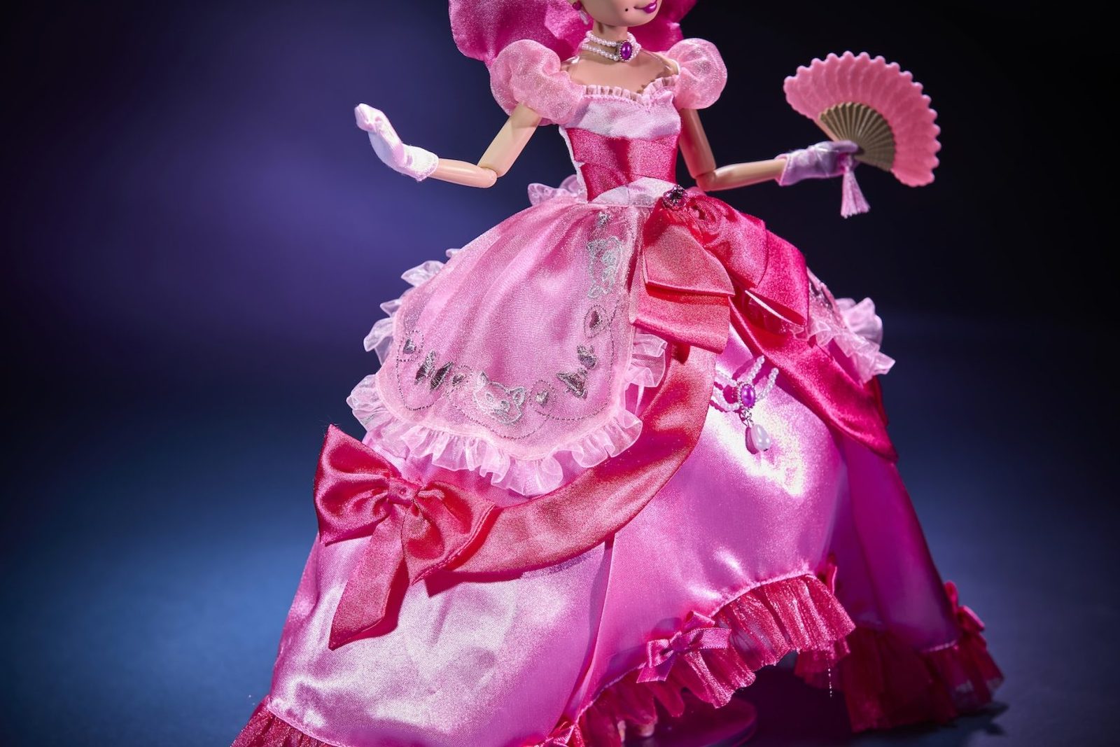 Close view of Lottie Designer Doll’s layered pink dress