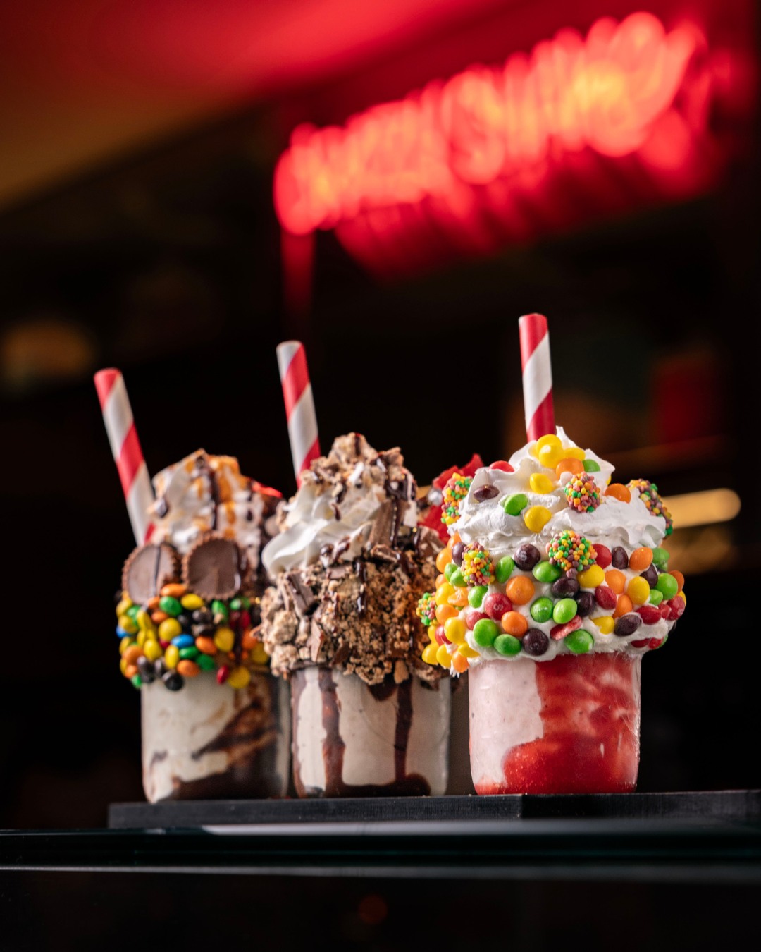 Black Tap Anaheim Trick or Treat Shake Flight with three candy-topped shakes
