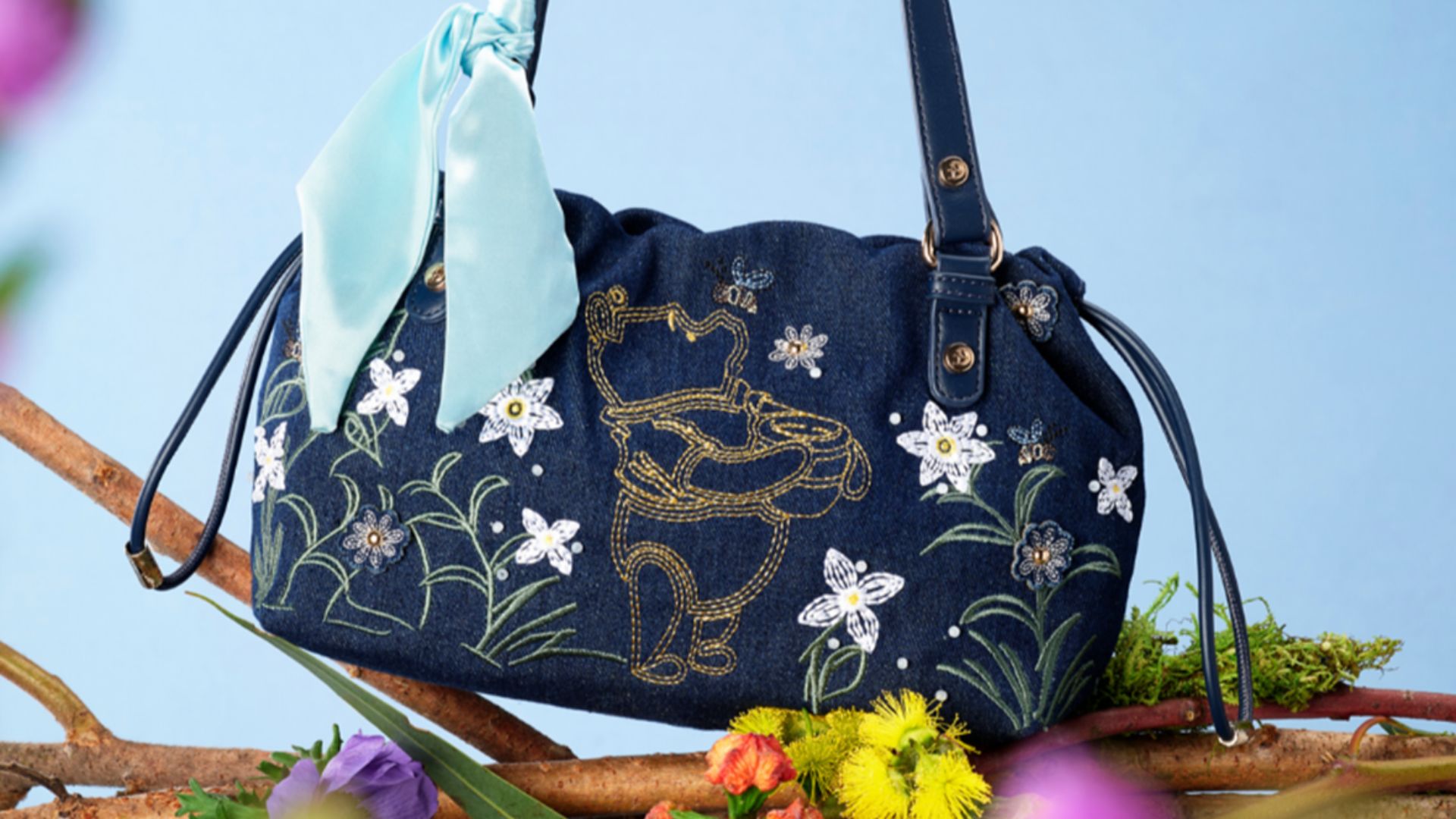 Blue Winnie the Pooh shoulder bag with embroidered honey pot, flowers and bees