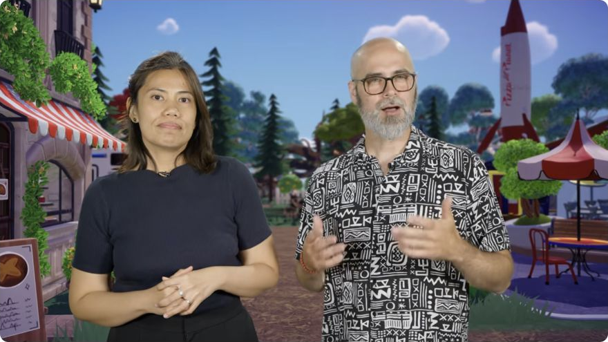 Two Disney Dreamlight Valley presenters stand in front of a Valley backdrop with a red rocket during the official 2026 Showcase