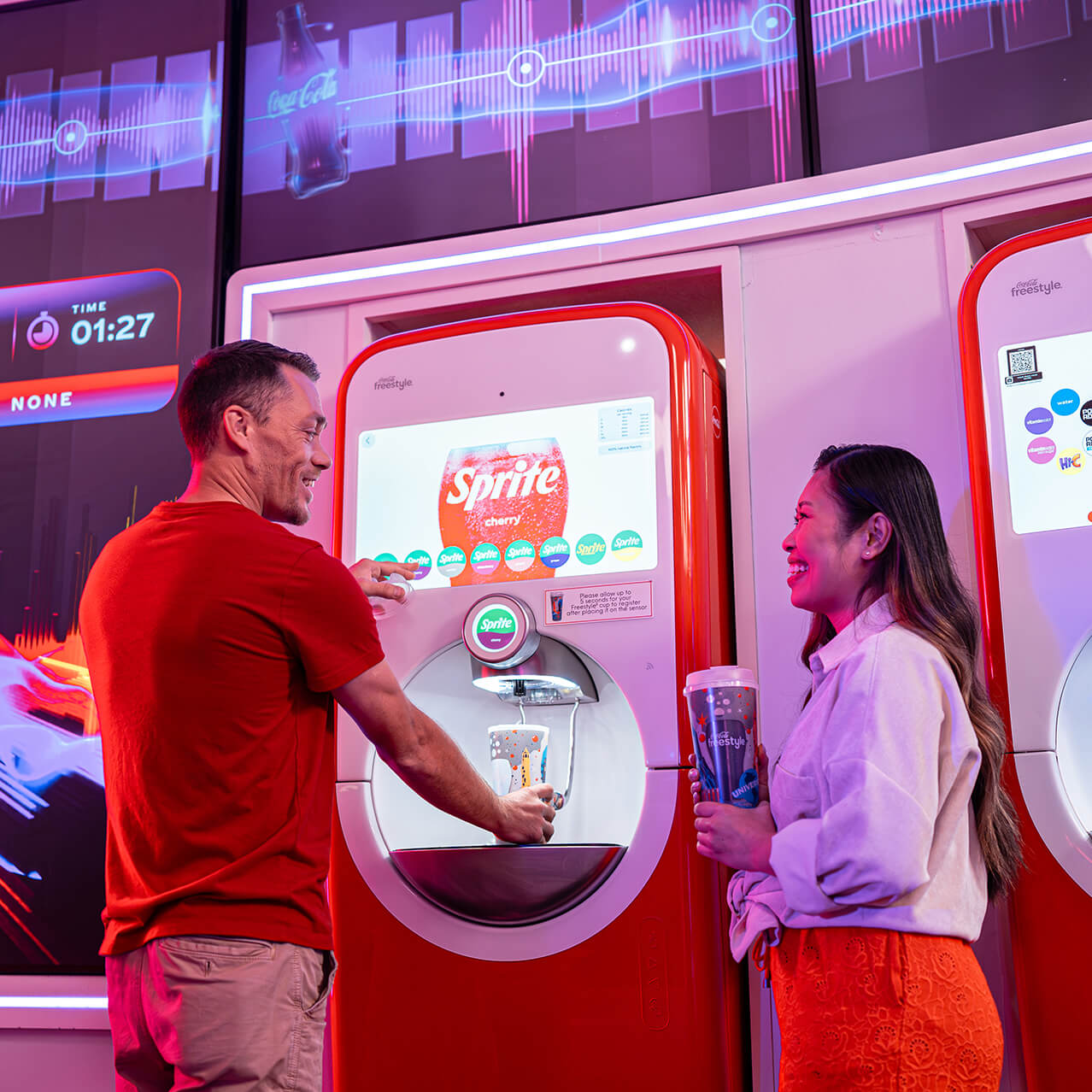Guests refill Universal Orlando Coca-Cola Freestyle souvenir cups