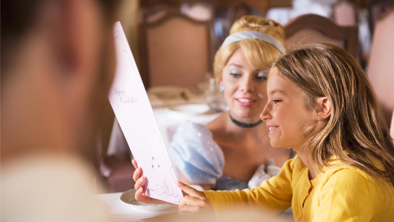 A Disney Princess meets a young guest inside Auberge de Cendrillon
