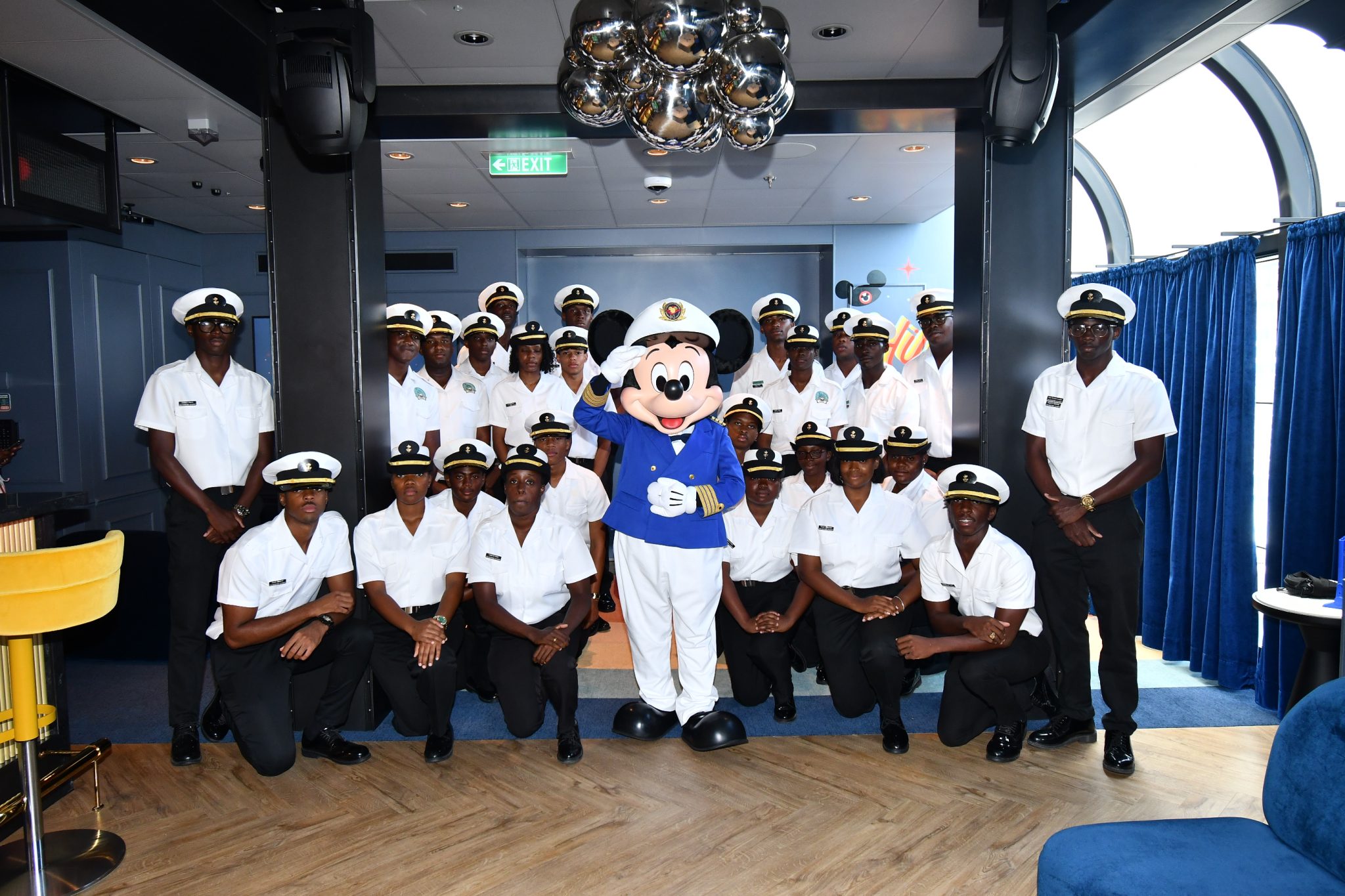 LJM Maritime Academy cadets pose with Captain Mickey aboard Disney Destiny