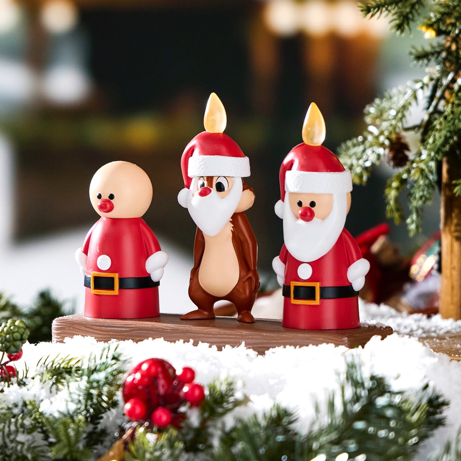 Three holiday candle figures from the Mickey Mouse Family Christmas collection