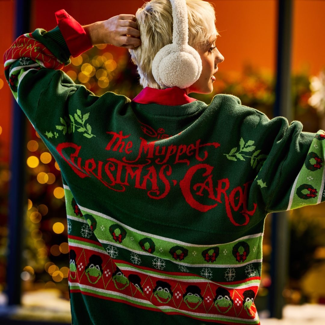 Green back of The Muppet Christmas Carol fleece crew with red lettering and character portraits