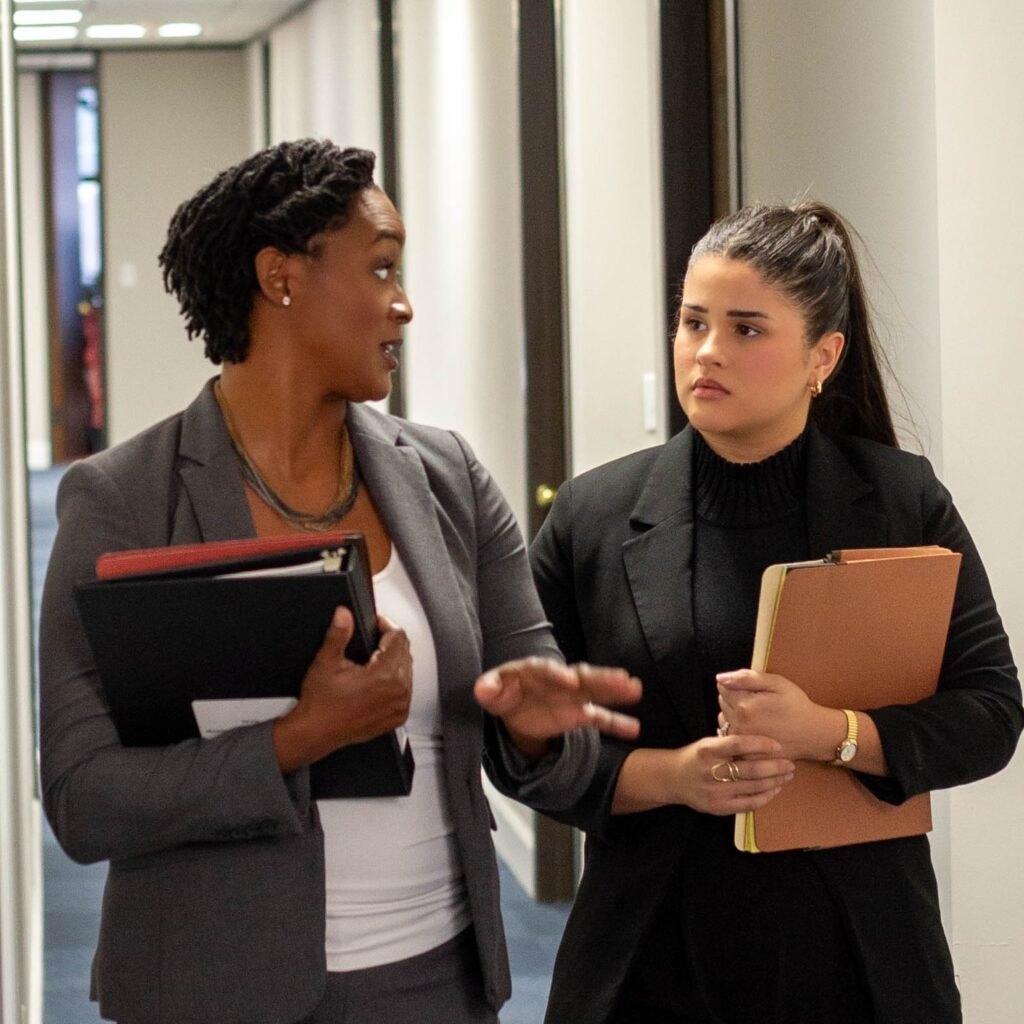Angie Nixon speaks with another woman in a photo from her campaign website