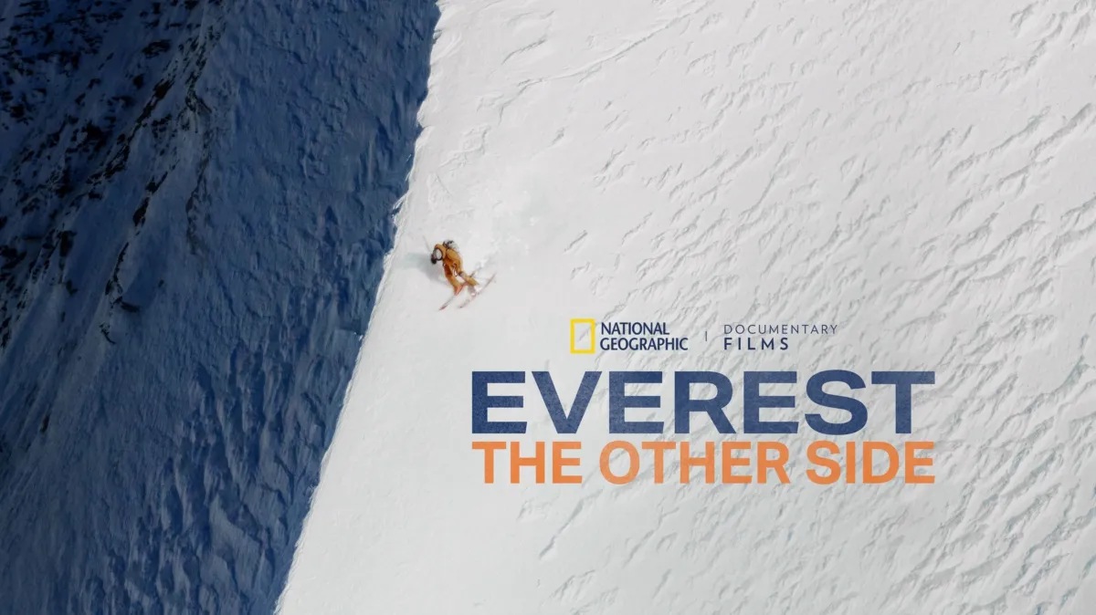 A ski mountaineer descends a steep snow face in the official Everest: The Other Side artwork
