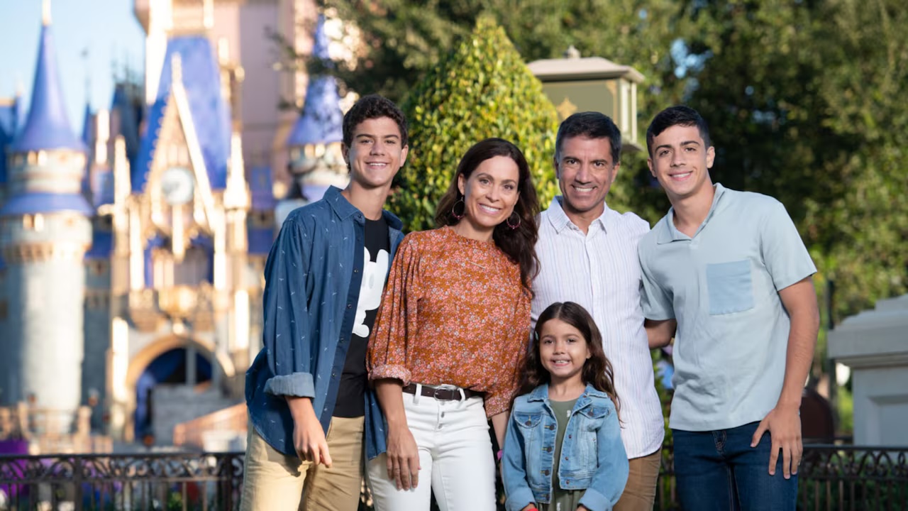 Family posing near Cinderella Castle at Magic Kingdom