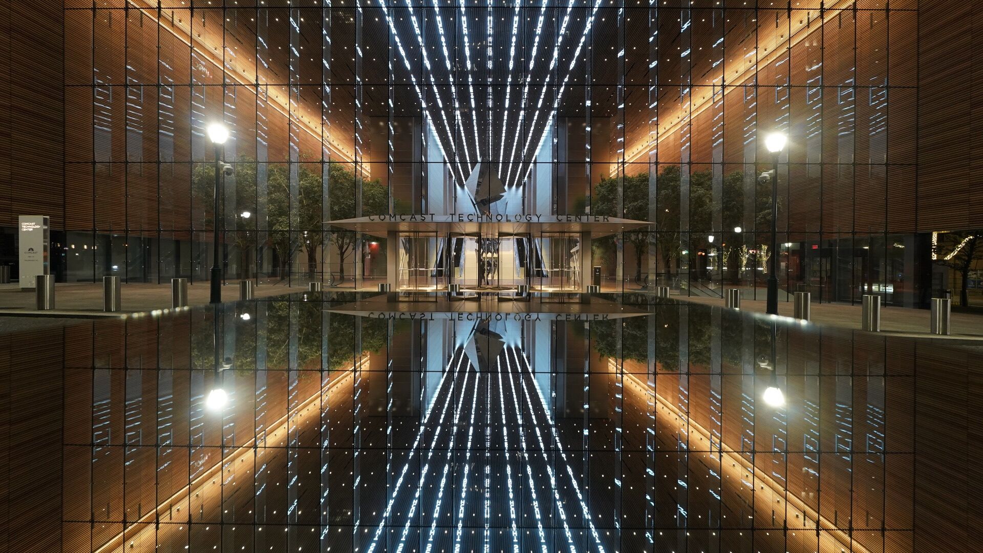 The illuminated entrance to the Comcast Technology Center in Philadelphia