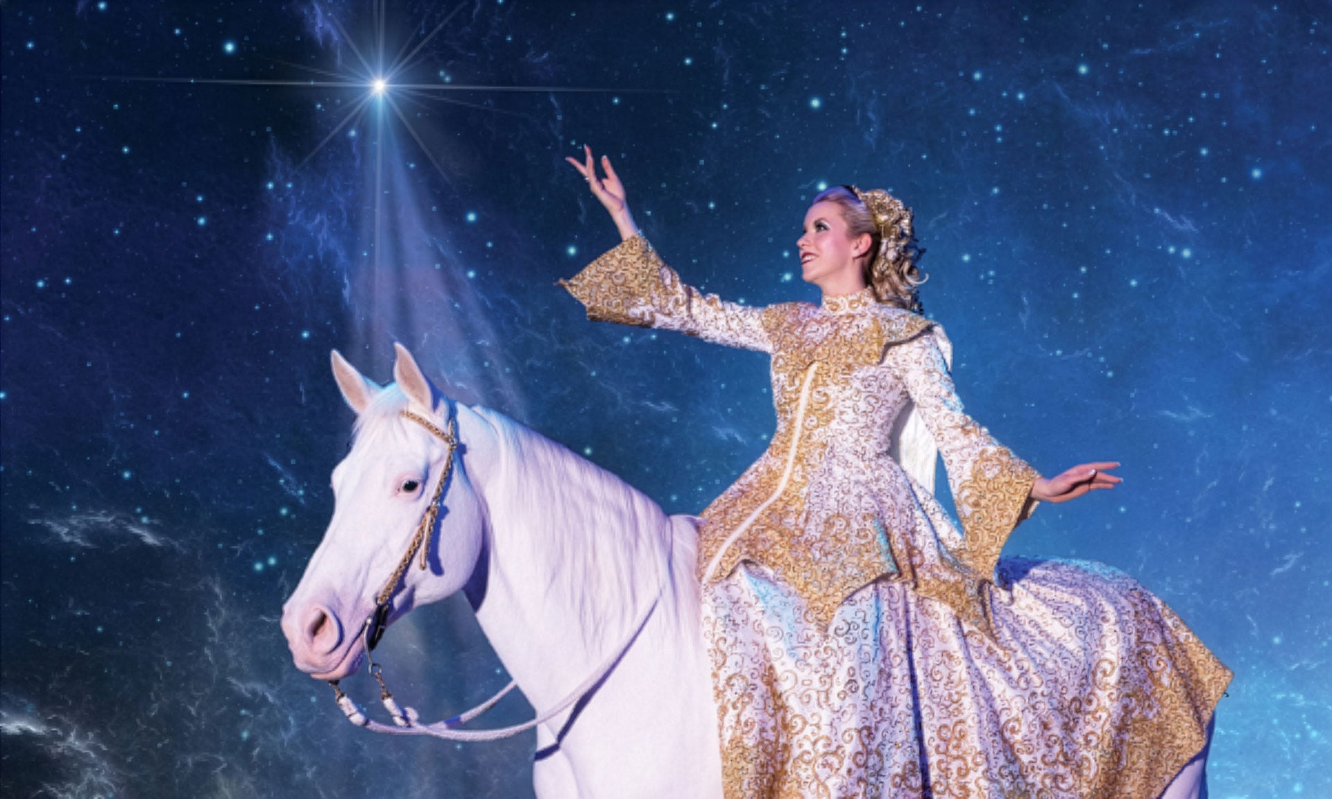 A performer in a gold costume rides a white horse during the Christmas show at Dolly Parton’s Stampede in Pigeon Forge