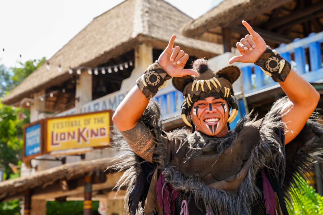 Alema Vaiaoga in Festival of the Lion King costume outside the theater at Disney’s Animal Kingdom