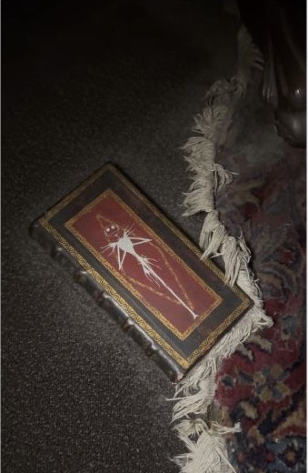 A small book open to an image of Jack Skellington inside Walt Disney World’s Haunted Mansion