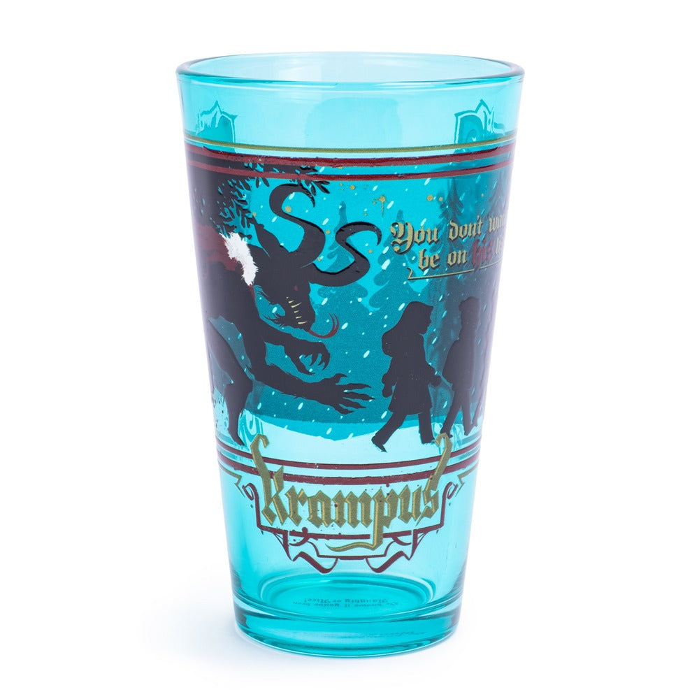 Blue Krampus glass with a dark silhouette and snowy woodland artwork