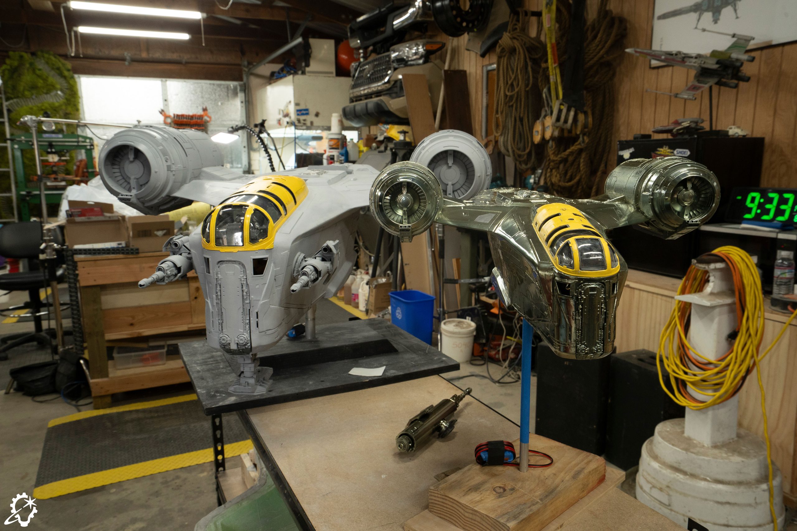 Four-foot and two-foot Razor Crest miniatures stand side by side in the ILM model shop