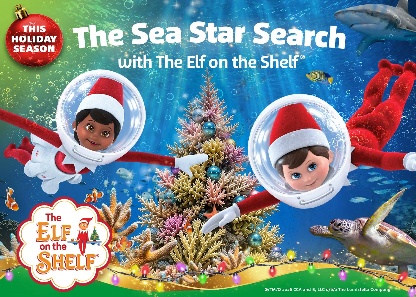 Two Elf on the Shelf characters in diving suits beside an underwater holiday tree