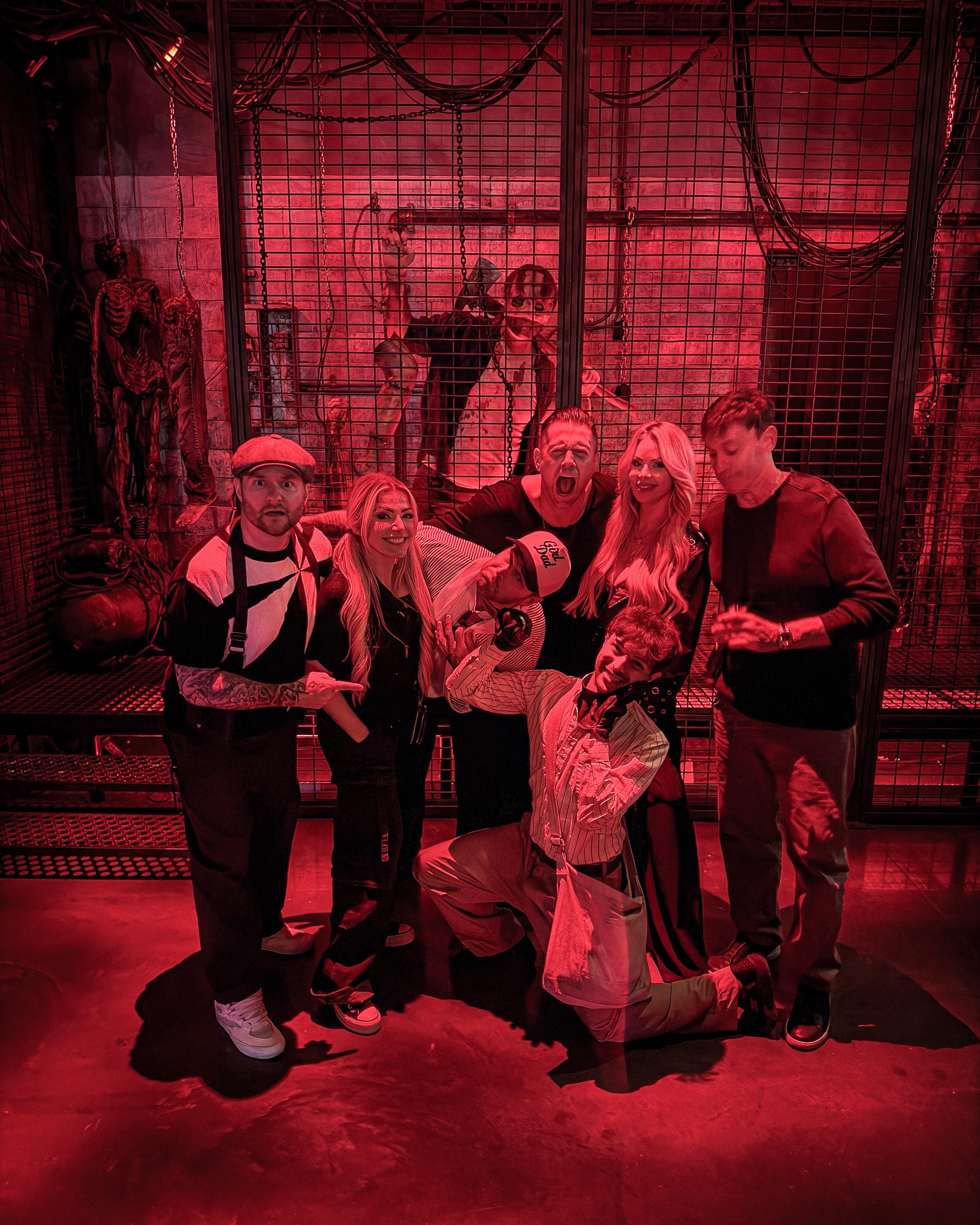 The Miz and guests pose with costumed performers at Universal Horror Unleashed in Las Vegas
