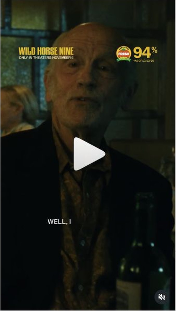 A man speaks during a bar-table scene in the official Wild Horse Nine clip