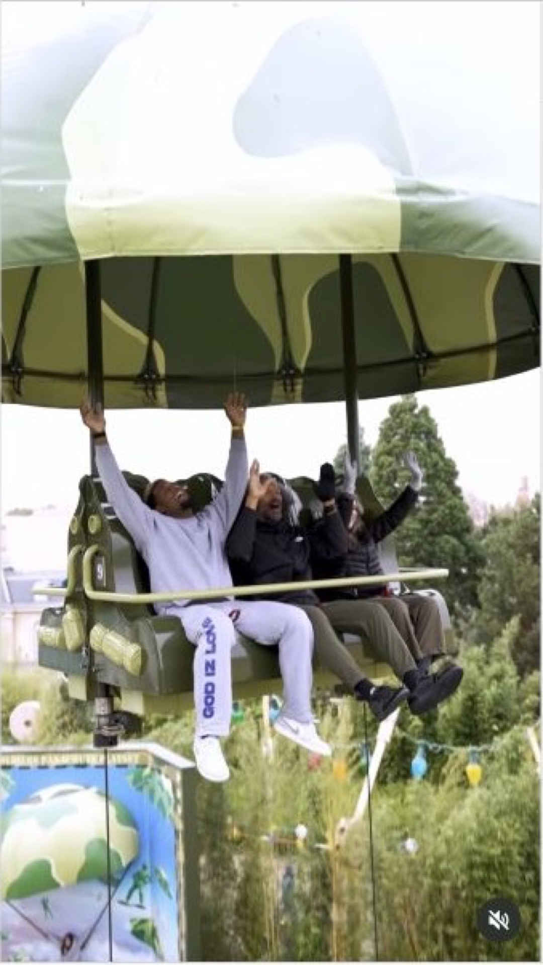 Cam Jordan raises both arms while riding a parachute-style attraction at Disneyland Paris in an ESPN video