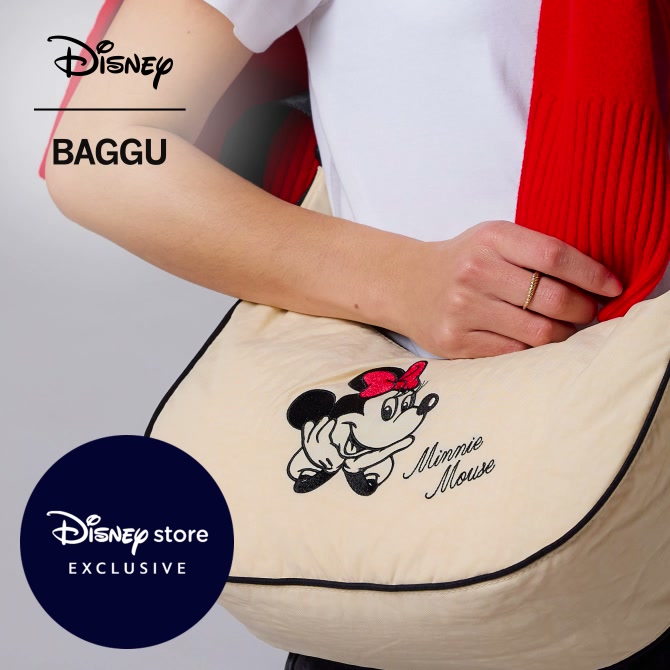 A model carries a cream Minnie Mouse bag in the official Disney | BAGGU video