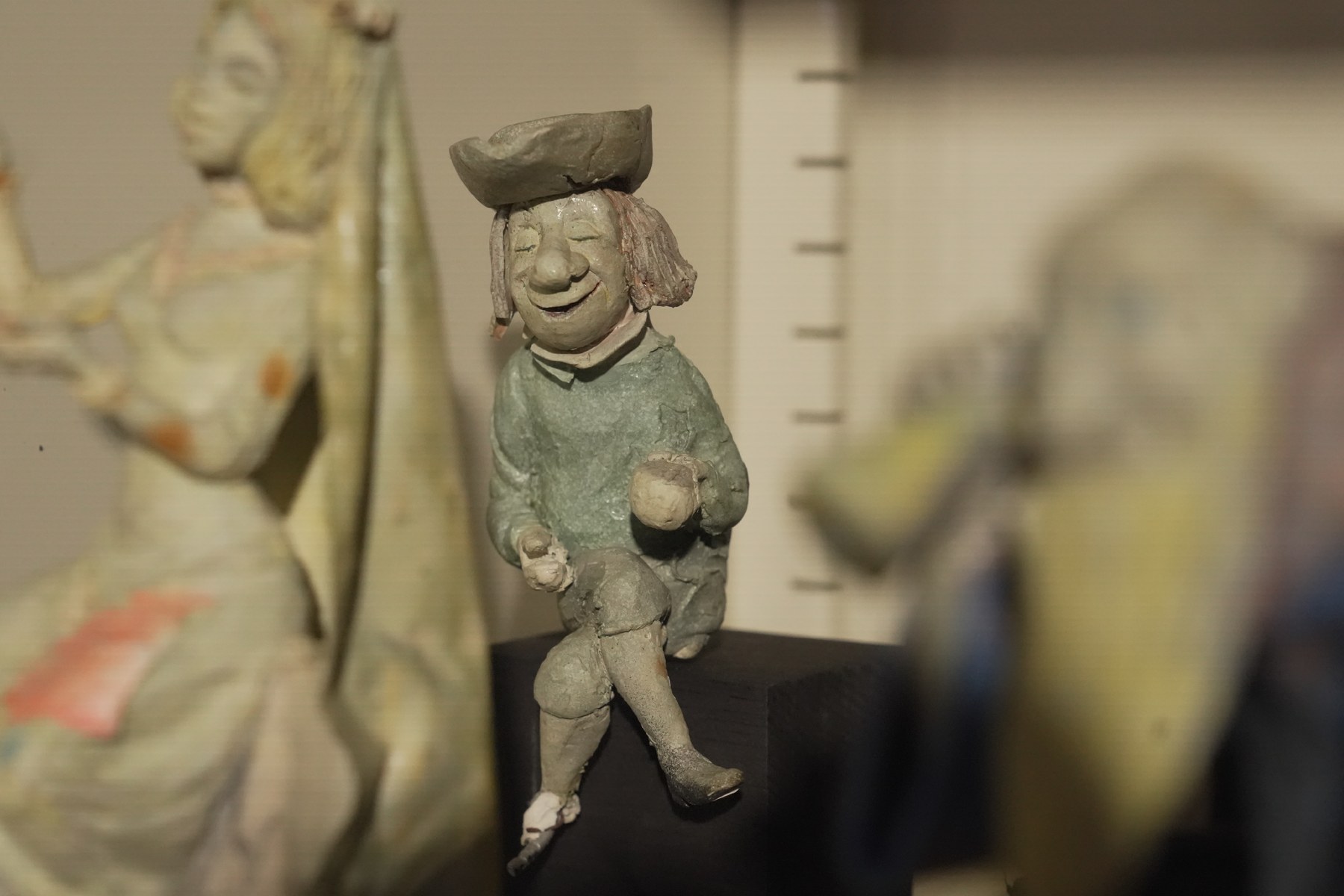 A grinning graveyard tea guest maquette