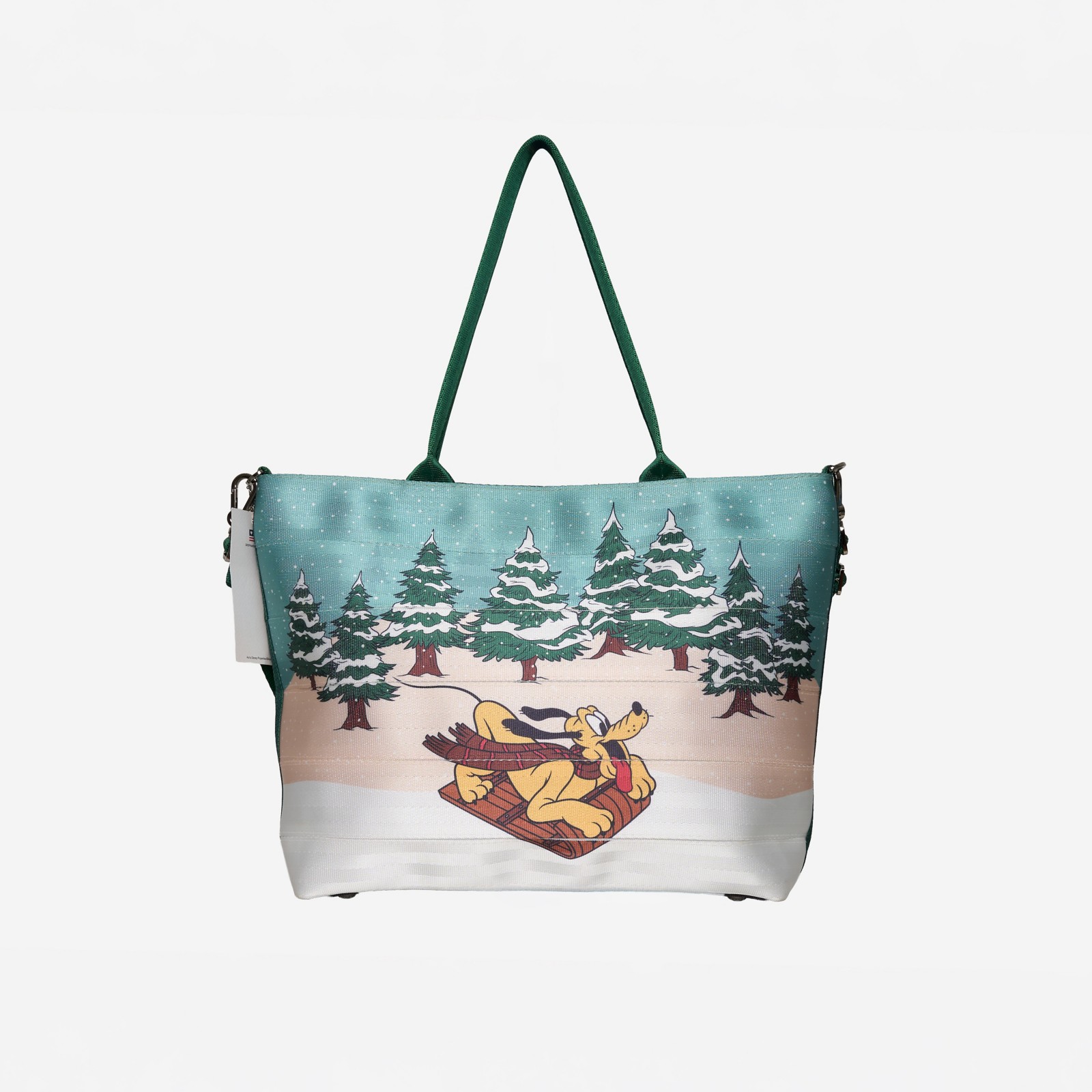 Harveys Disney Parks holiday tote with Pluto sledding through a snowy forest scene