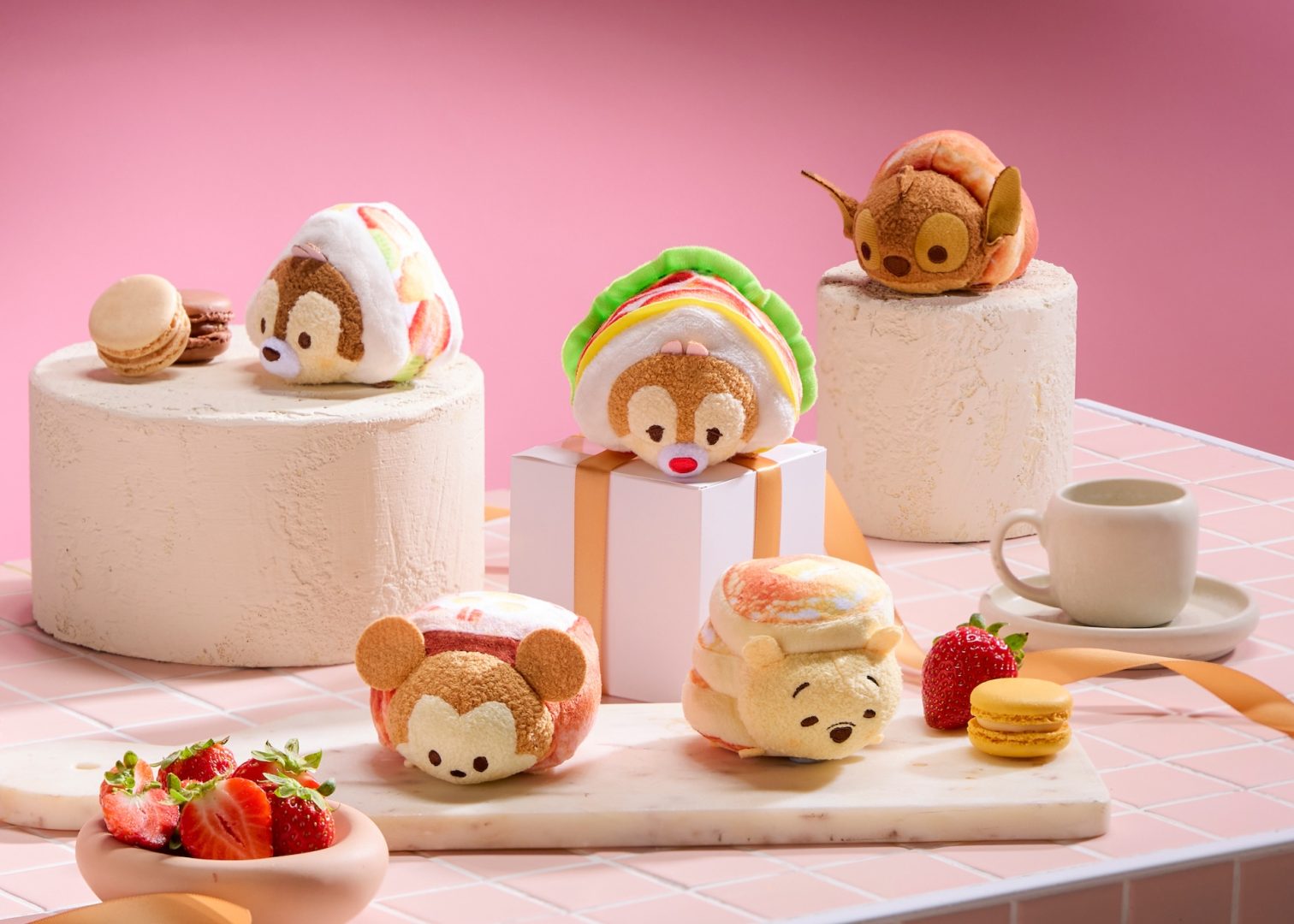 Mickey, Chip, Dale, Winnie the Pooh and Stitch Tsum Tsum bakery plush arranged with pastries