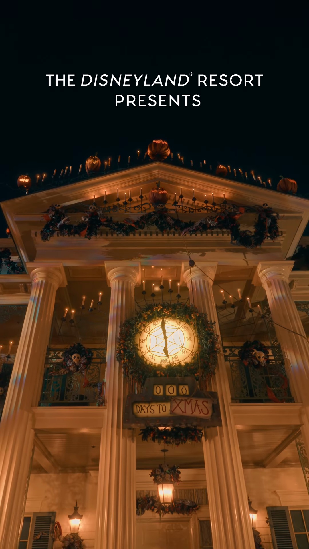 Haunted Mansion Holiday entrance decorated with pumpkins, candles and the Days to Xmas clock