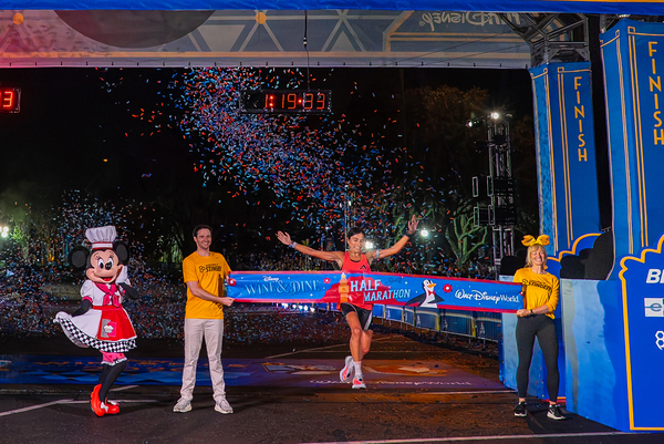 Diana Bogantes Gonzalez crosses the Disney Wine & Dine Half Marathon finish line
