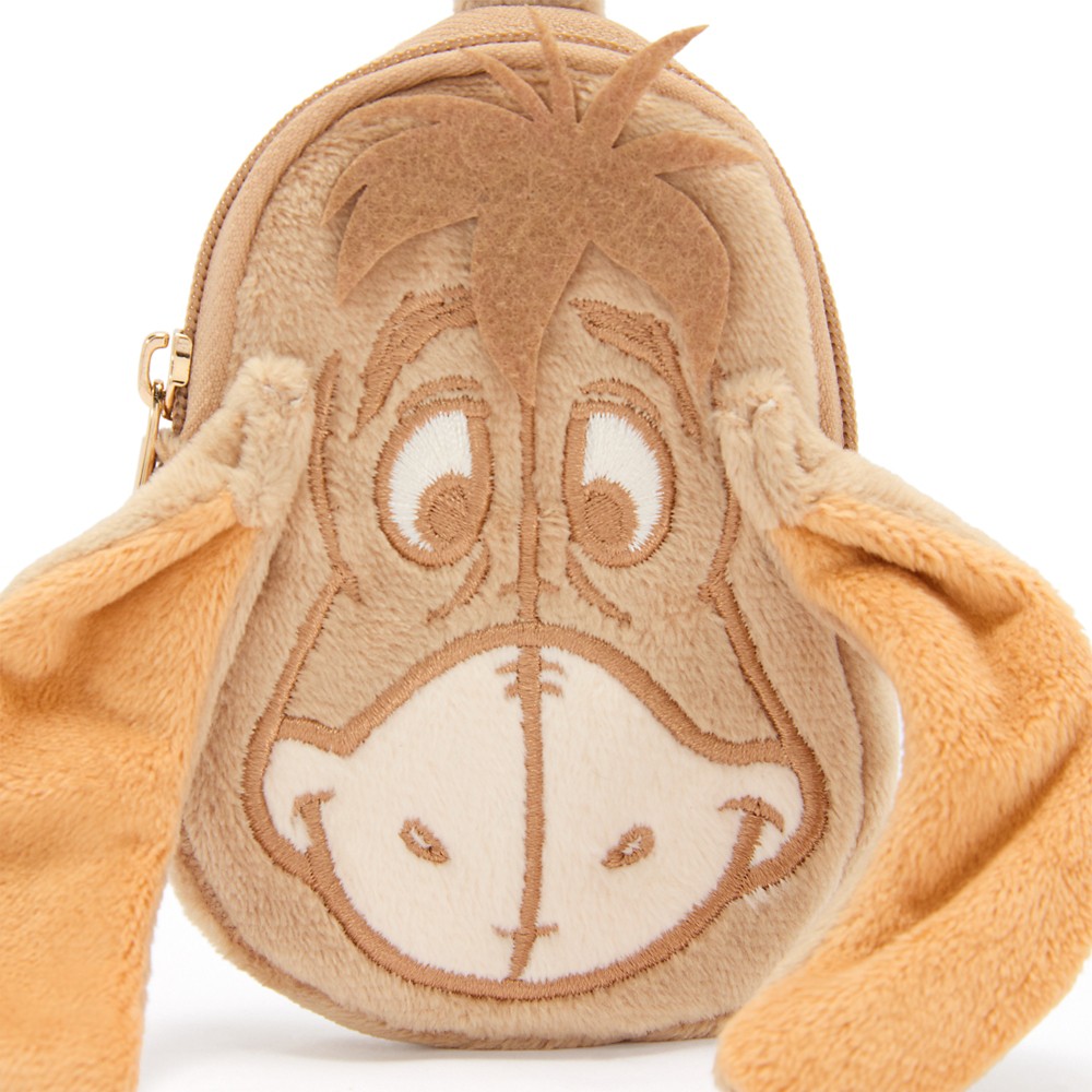 Close view of Eeyore's embroidered face and felt hair tuft