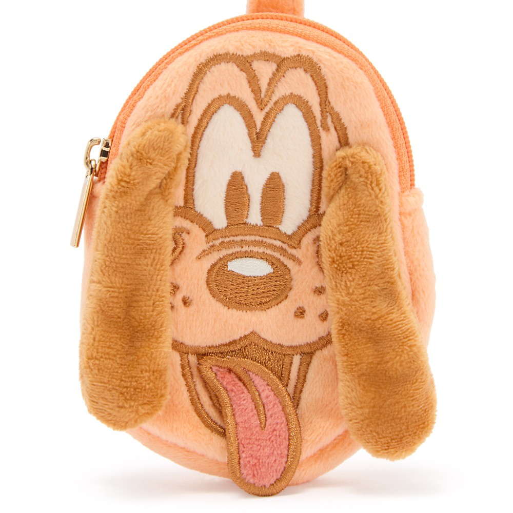Close view of Pluto's embroidered face, floppy ears and plush tongue