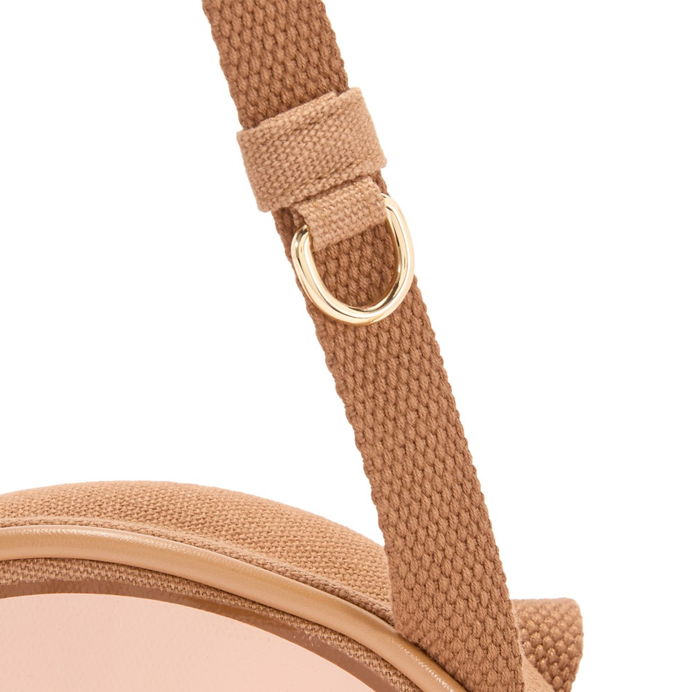 Adjustable strap hardware on the Stitch crossbody bag