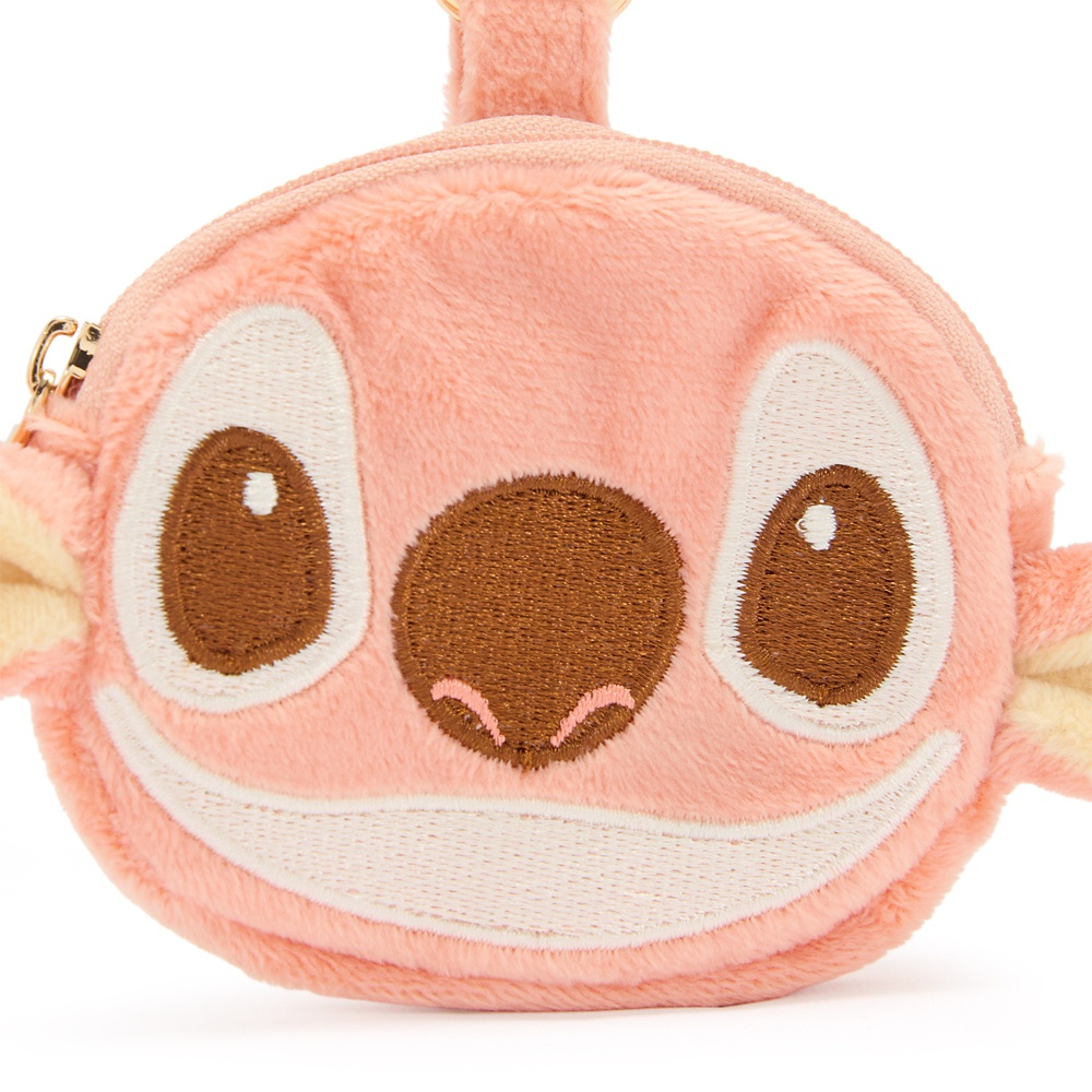 Close view of Stitch's embroidered face on the pink plush coin purse
