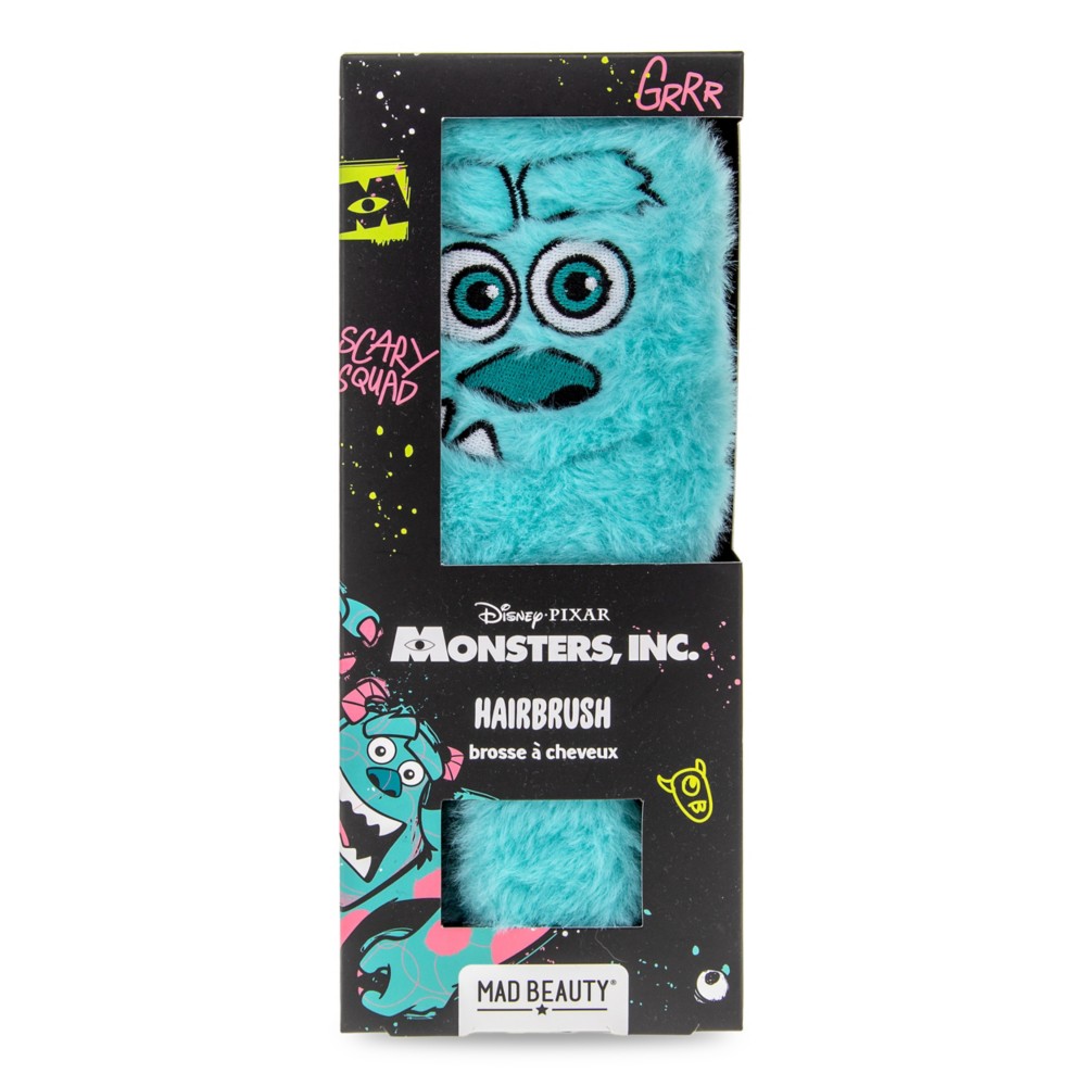 Fuzzy blue back of the Sulley hairbrush with embroidered face