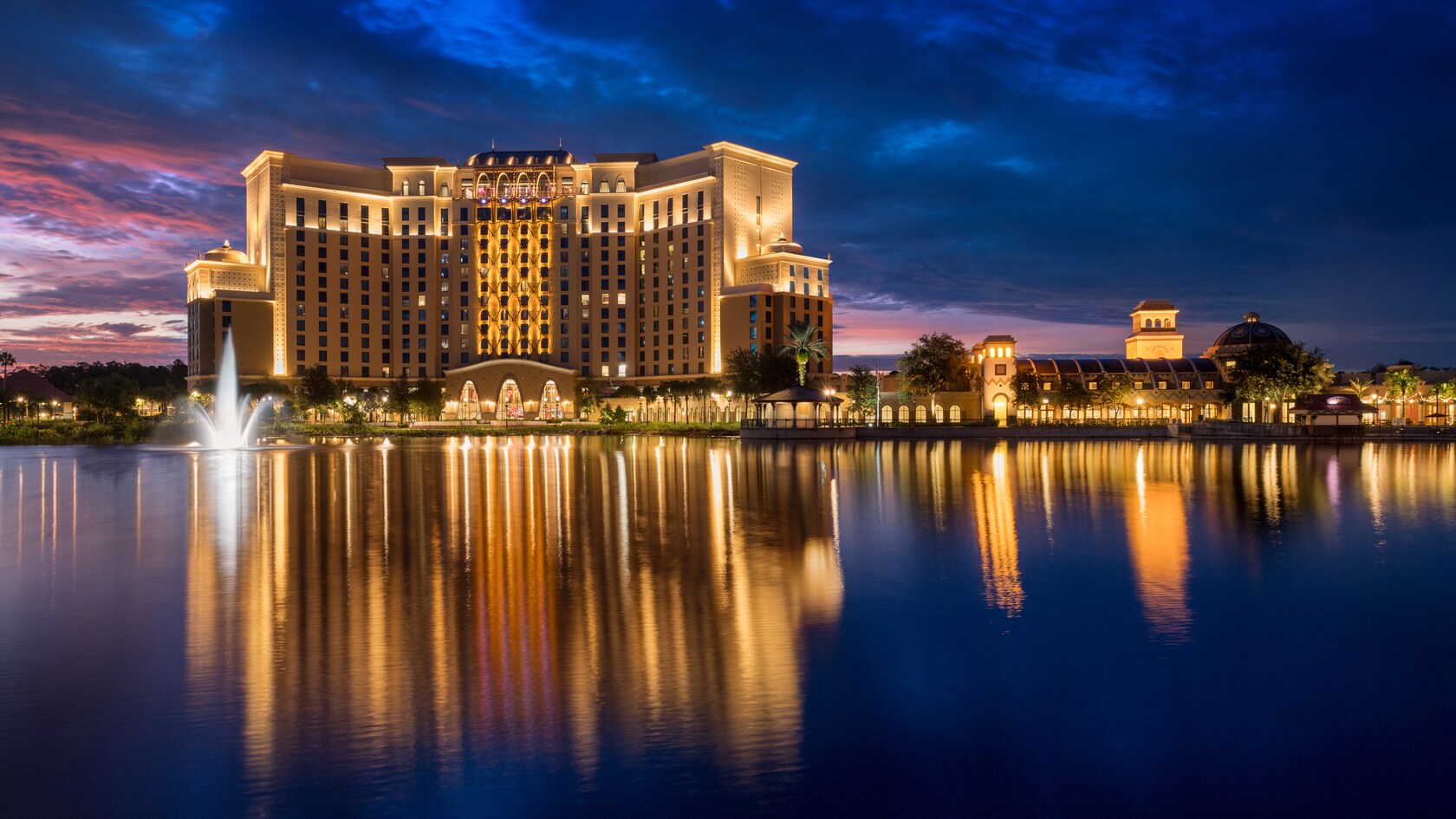 Disney's Coronado Springs Resort reflected in the lake at Walt Disney World