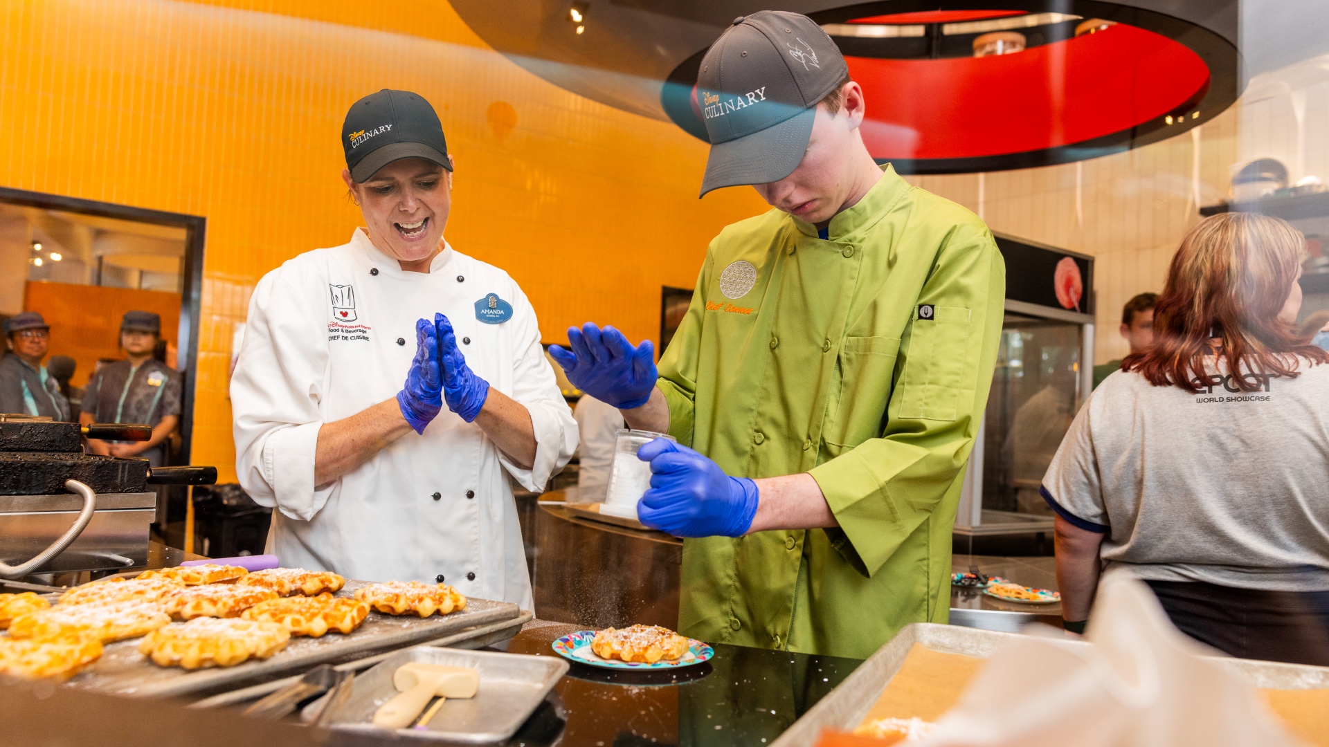 Connor prepares a Liège waffle with a Disney chef at EPCOT