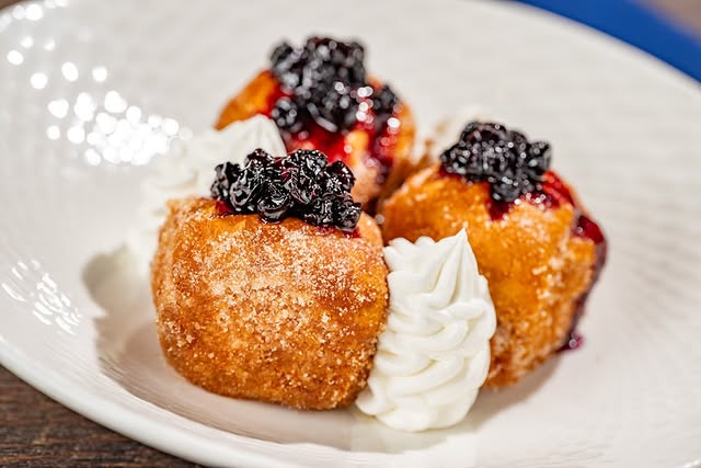 Stuffed French toast with berry compote and cream at Ale and Compass Restaurant