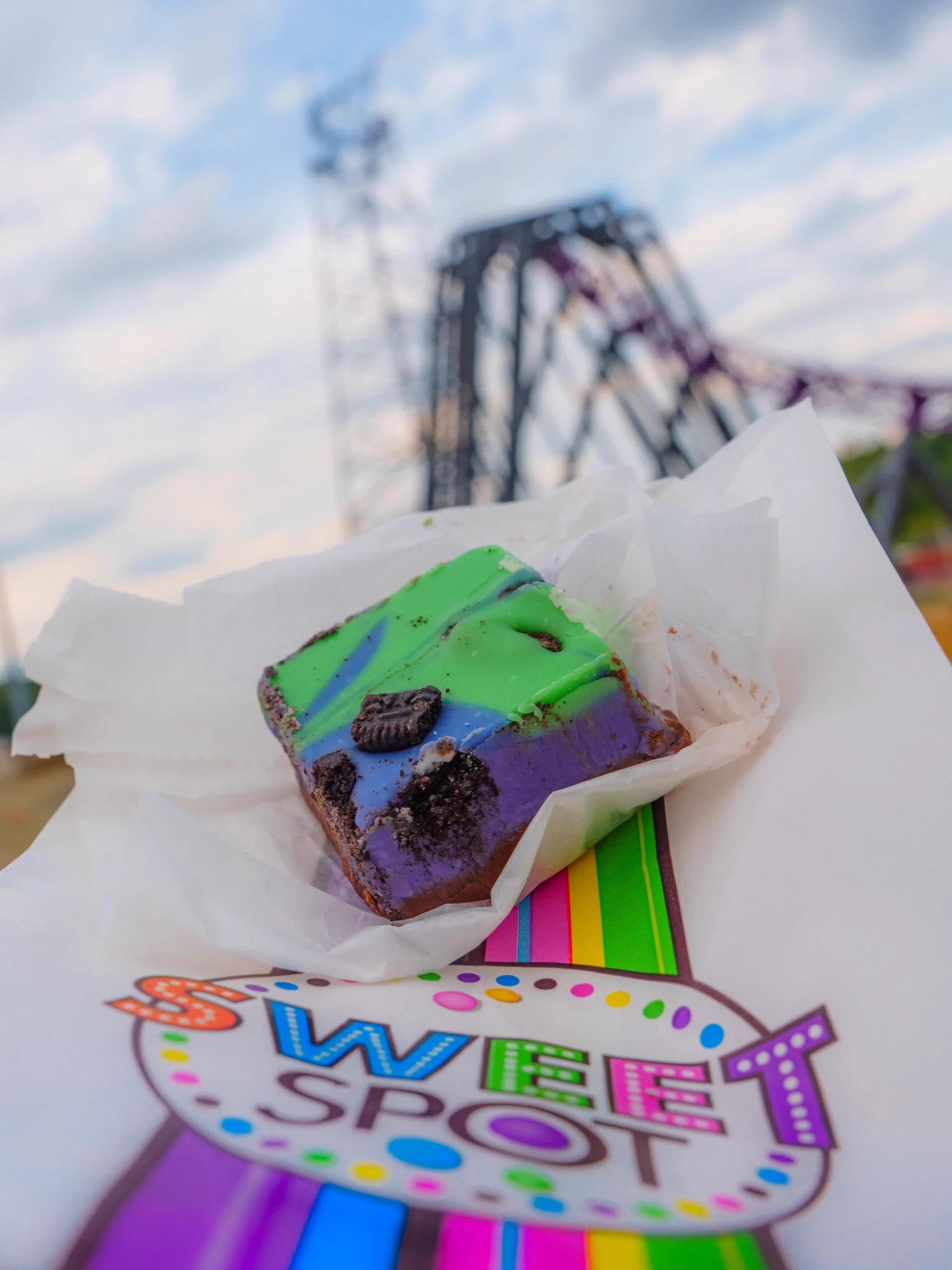 Green, blue and purple Bakunawa-themed fudge on a Sweet Spot tray