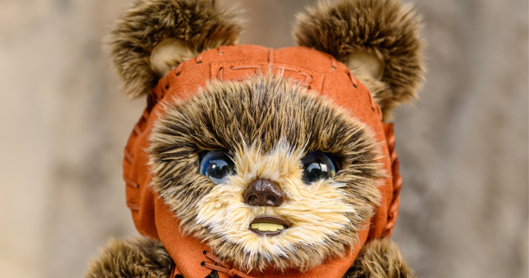 The interactive Batuu Adventure Buddies Ewok wearing an orange hood