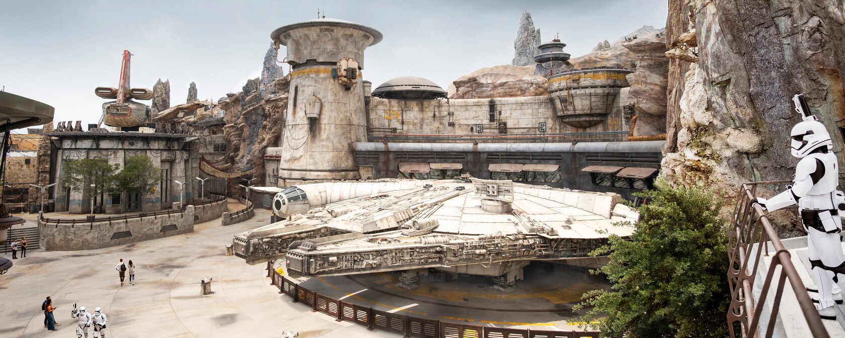 A stormtrooper overlooks the Millennium Falcon in Star Wars: Galaxy's Edge