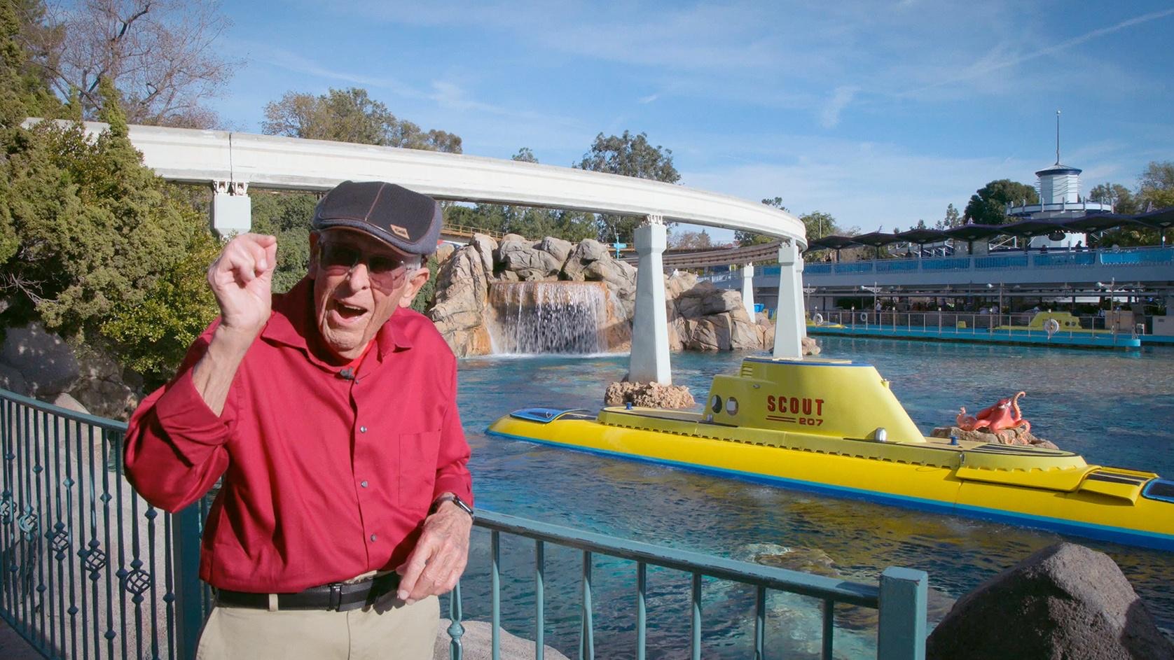 Bob Gurr beside the Finding Nemo Submarine Voyage lagoon at Disneyland