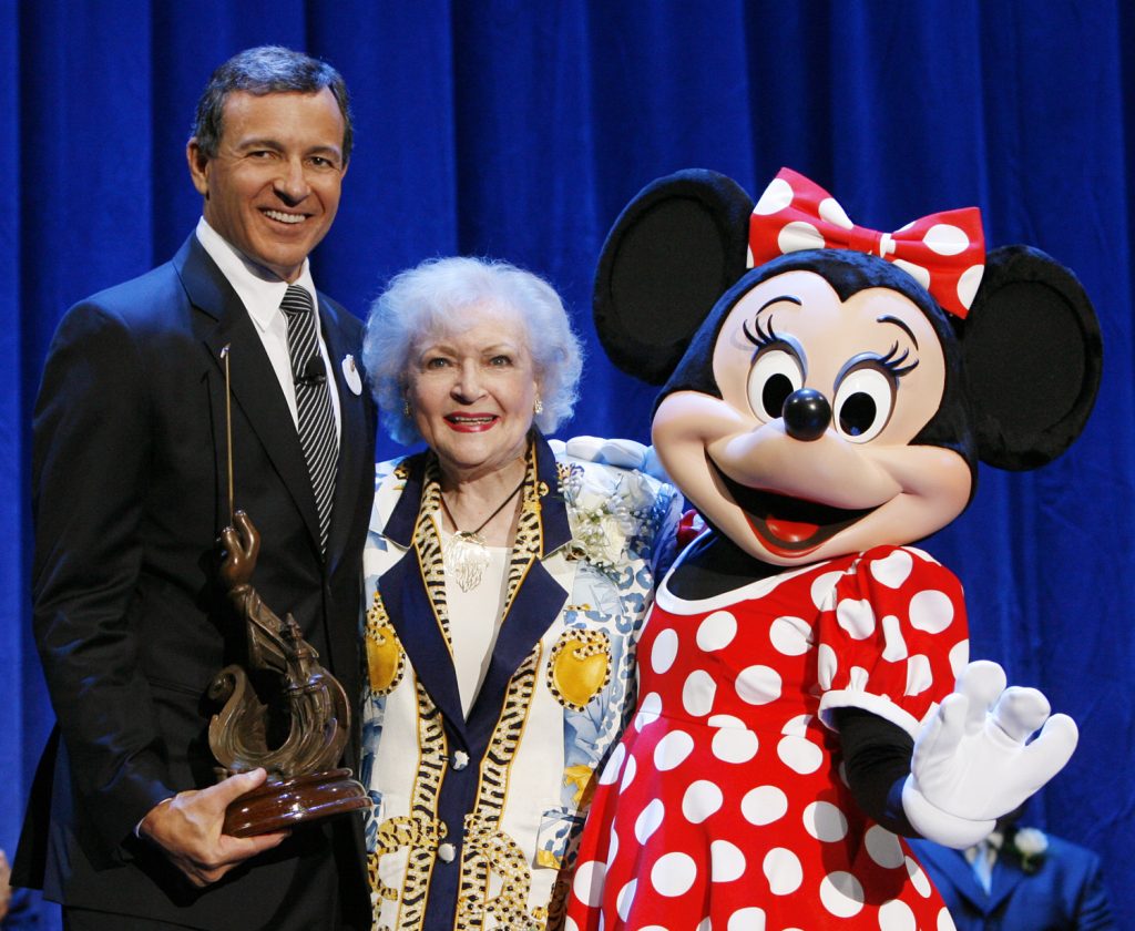 Bob Iger stands with Betty White and Minnie Mouse at an ABC event