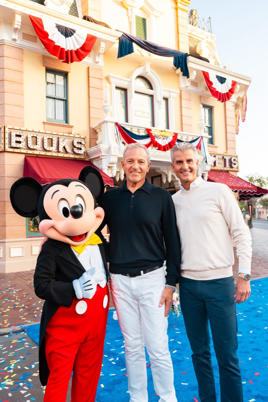 Bob Iger stands in front of his Main Street window at Disneyland