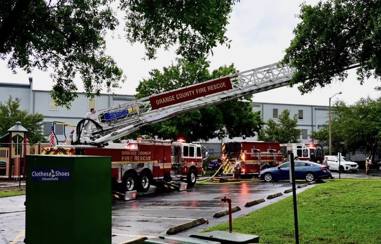Orange County Fire Rescue trucks parked outside Buena Vista Place Apartments