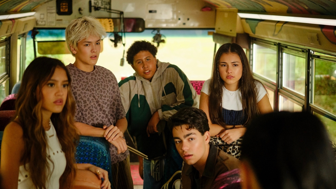 Sage, Fletch and other Camp Rock 3 characters listen inside a school bus