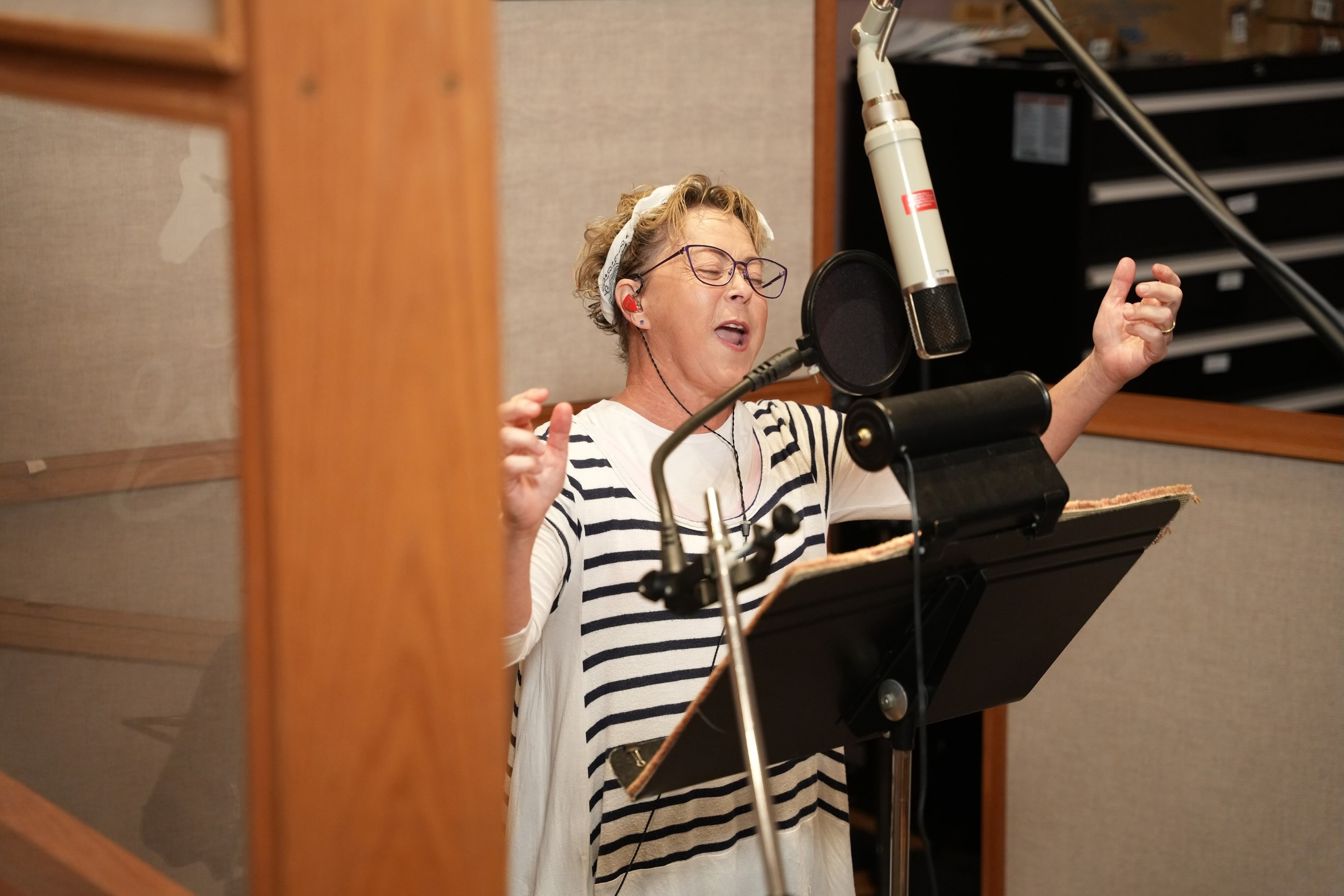 Debi Derryberry in the recording studio for the updated Carousel of Progress