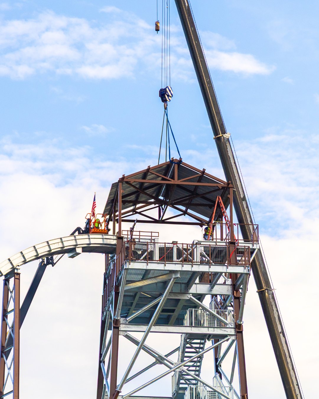 Close view of the Rip Roarin' Falls roof structure being lifted into place